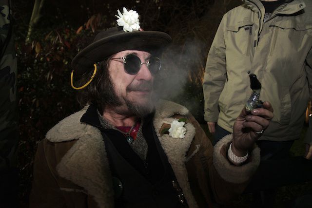 "A man known as "Professor Gizmo," smokes marijuana in a glass pipe, Wednesday, Dec. 5, 2012, just before midnight at the Space Needle in Seattle."